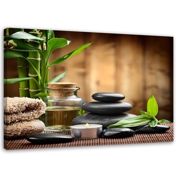 Zen composition with black stones and bamboo